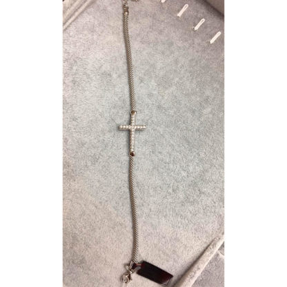 BRACCIALE RIGIDO CON VISTOSA CROCE BRILLANTATA